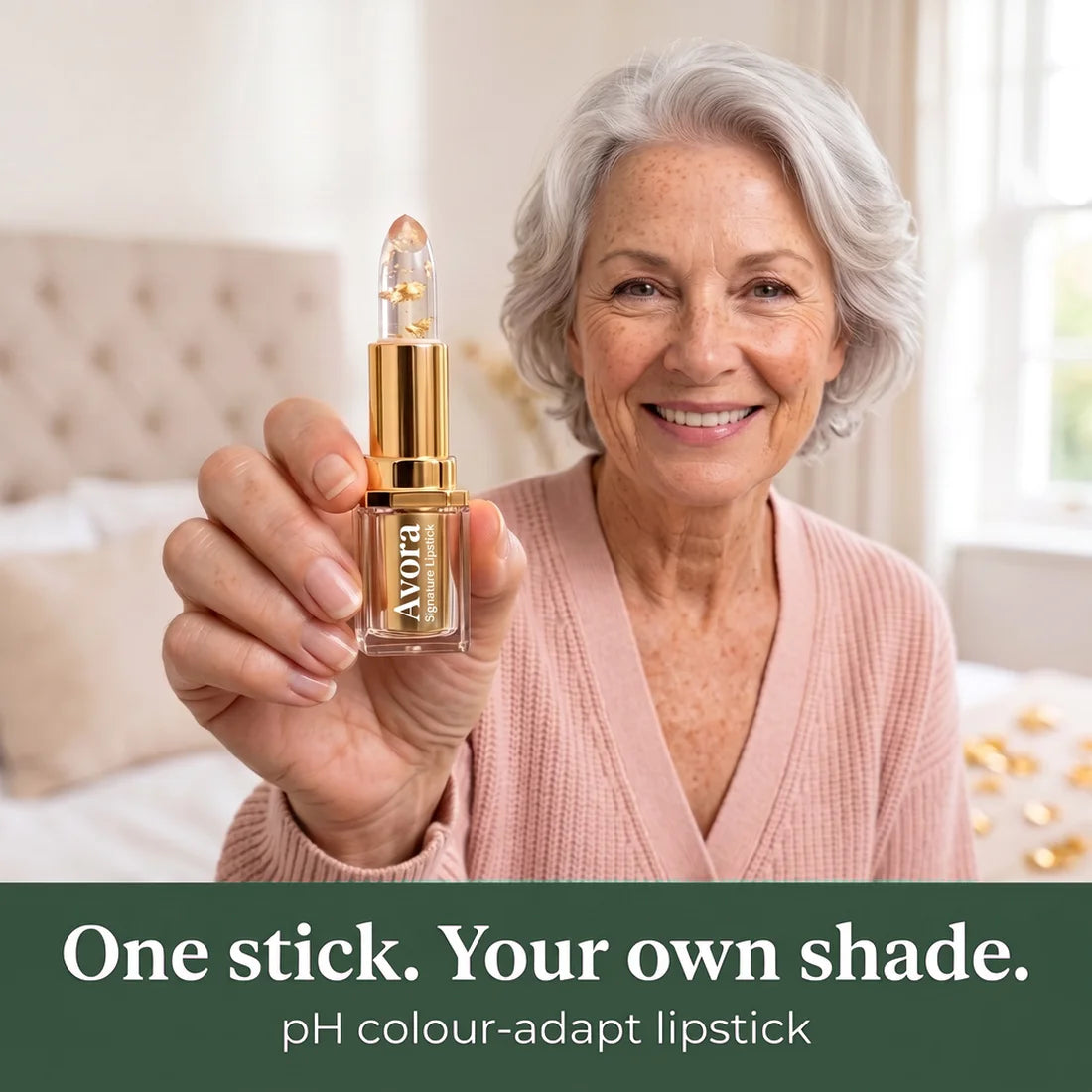Woman over 60 holding the Avora lipstick